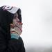 Richmond resident Abby Shaw from the Freezing Dead team smokes a cigarette before jumping in Ford Lake for the Frozen Leap on Saturday, Feb. 16. Daniel Brenner I AnnArbor.com